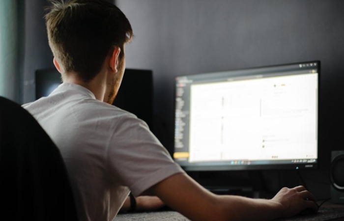 A contest manager using a computer to find top contest software that enables customization of contest rules, prize management, and entry submission processes 
